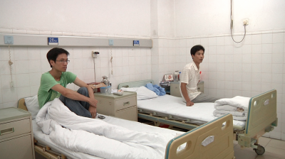 Hospitalized workers in China, injured by unprotected chemical usage.