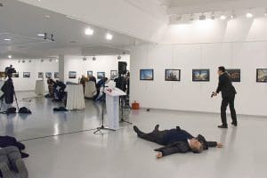 The slain Russian ambassador to Turkey and his assailant. (NYTimes photo)